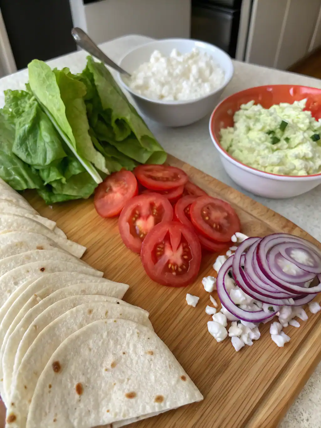 Ingredients for cottage cheese wrap recipe including cottage cheese, eggs, and seasonings