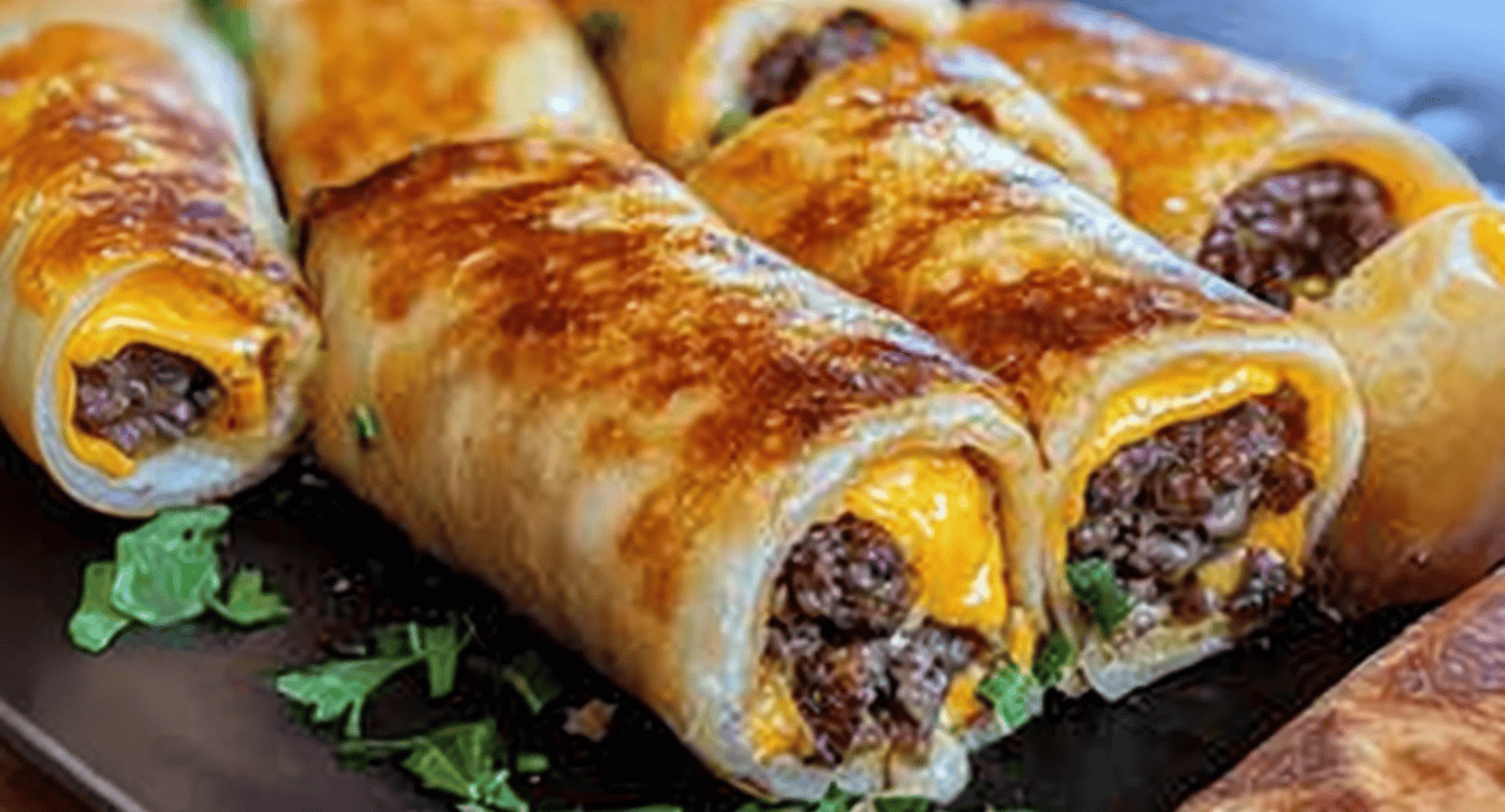 Crunchy beef and cheese wrapped enchiladas with melted cheddar, garnished with fresh herbs.