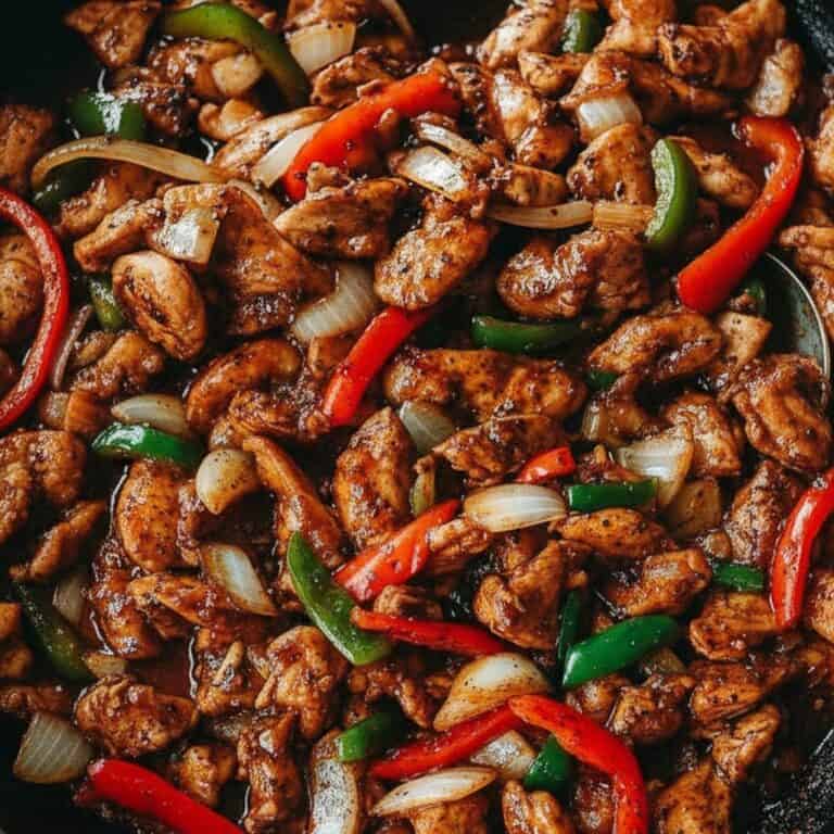 Stir-fried chicken with colorful bell peppers and onions, a delicious and easy recipe perfect for dinner or lunch, featuring savory Asian-inspired flavors from Recipestang.